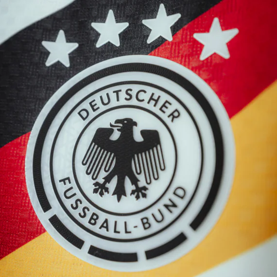 Close-up of the DFB crest with four stars on a Germany shirt.