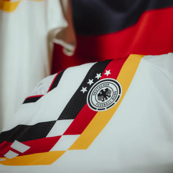 Detail photo of a Germany shirt with DFB crest and colored design elements.